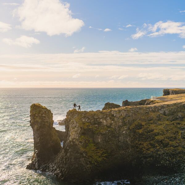 Cliffside destination engagement photo ideas
