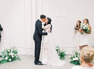 Paige Saxton-Getty and Hayden Graham relied on a white color palette with pops of greenery for their modern, minimalist wedding at HNYPT. "The inspira