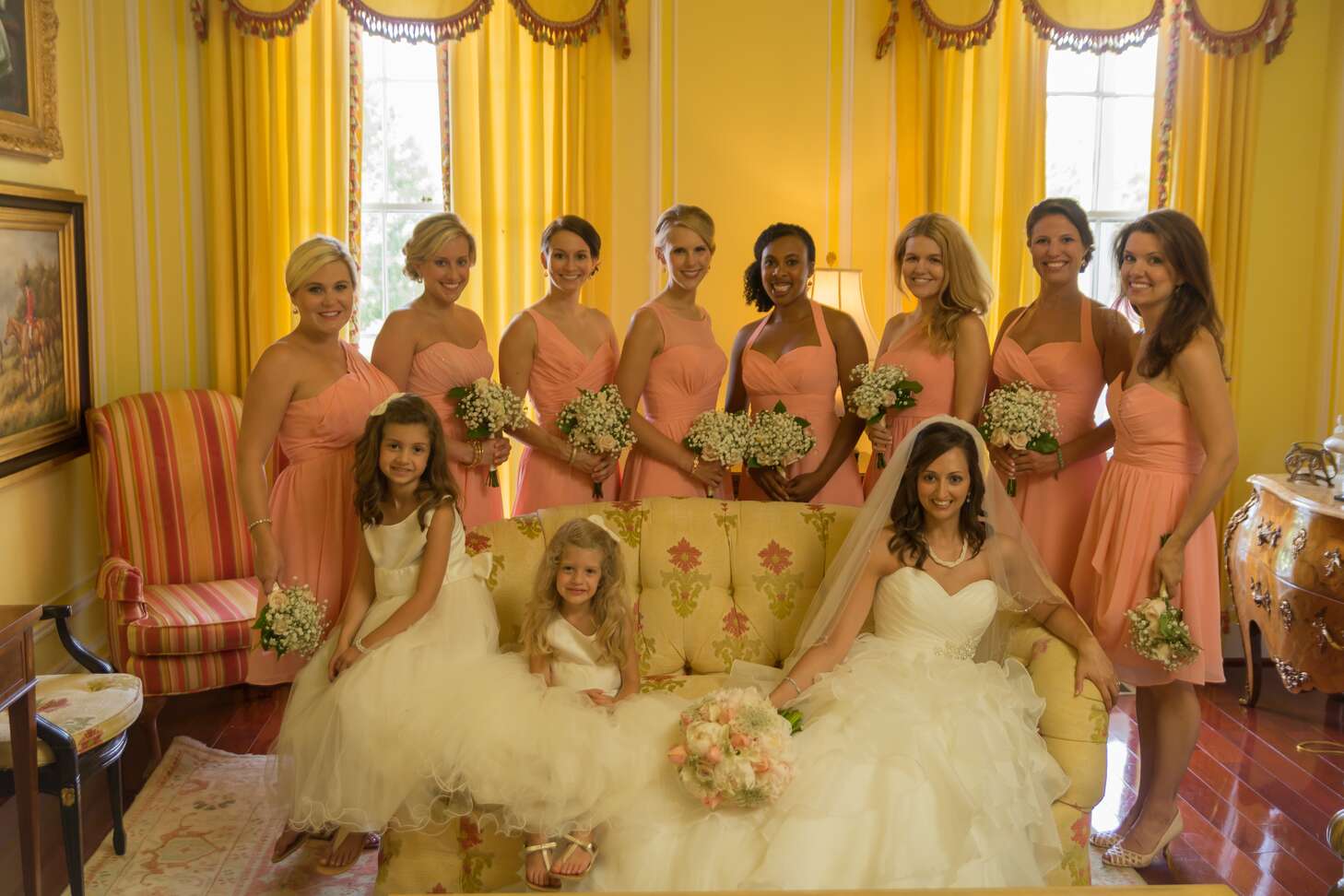 Short Coral Bridesmaid Dresses with Baby's Breath Bouquets