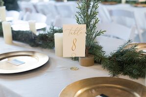 Gold Table Number Sign on Table With White Linen and Wintery Runner