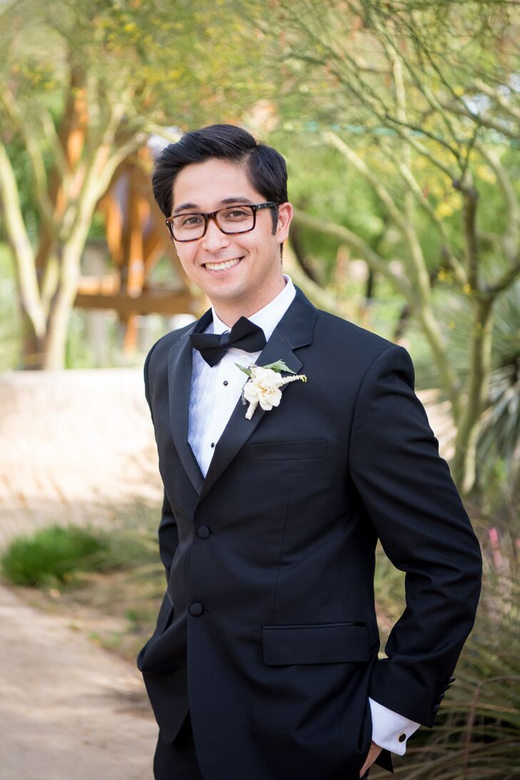Marc wore a black tuxedo, a crisp white button-down and a black bow tie. His boutonniere was peach and lavender.