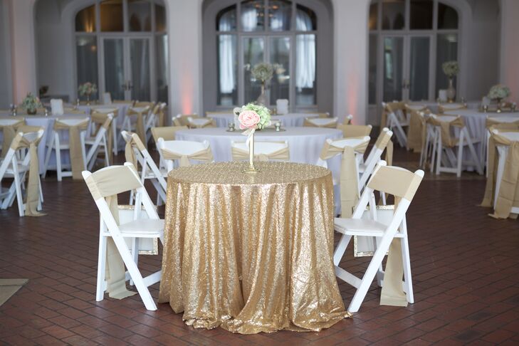 Kara and Nick's sweetheart table had a gold metallic tablecloth that matched the gold fabric on their white folding chairs. A single vase centerpiece of garden roses and hydrangeas allowed for easy dinner conversation.
