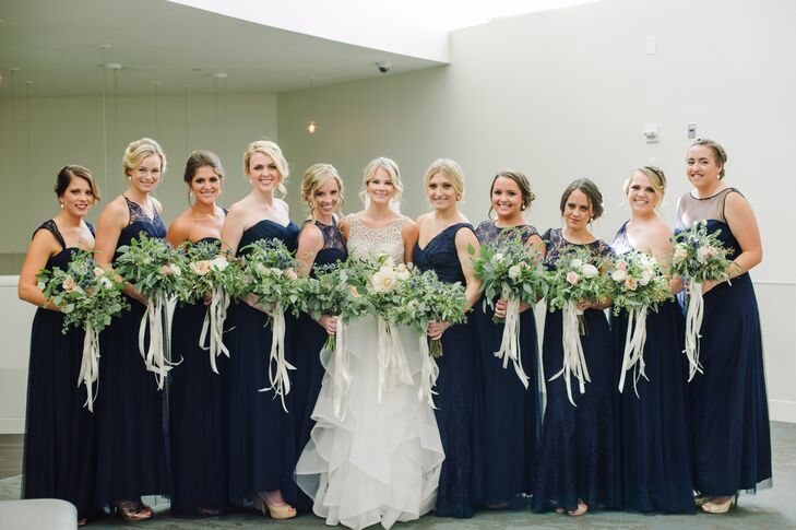 The only criteria Millie had for her bridesmaid dresses was that they be navy and floor length. It was important to her that all her best friends felt comfortable, so in order to accommodate a range of body types, she let each woman choose a gown in a different style.
