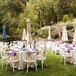 Vineyard Estate Reception With Round Tables, White Linens, Umbrellas on Lawn
