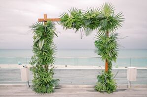 Palm-Covered Waterfront Ceremony Wedding Arch
