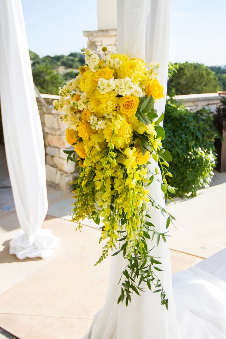 Yellow floral arrangements brightened up the tented courtyard of the One World Theatre in Austin, Texas.