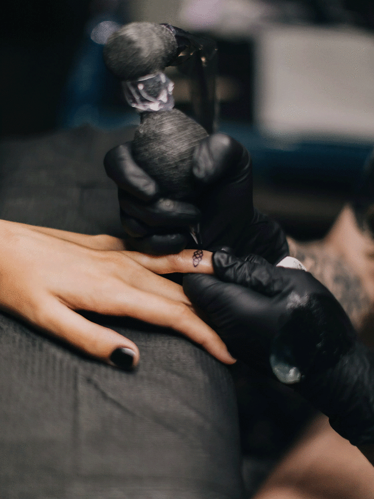 Bride and groom had their wedding rings tattooed on during their wedding reception.