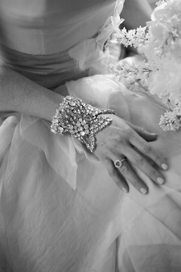 The bride kept her wedding day accessories simple—no veil, no headpiece, no necklace—with just a simple yet elegant bracelet and drop earrings found at  L’Atelier Couture Bridal Boutique in Minneapolis, Minnesota.