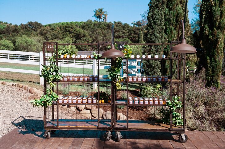 Blood orange marmalade in glass jars had labels portraying antique images of the Santa Barbara, California, estate where the wedding took place. These items served as wedding favors and also as escort cards that guided guests to their seats.
