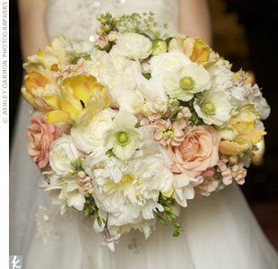 Dixie carried an arrangement of poppies, roses, peonies, ranunculus and tulips. She had her florist add a few stems of Queen Anne’s lace as well, since they grow along the road near her grandparents’ farm.