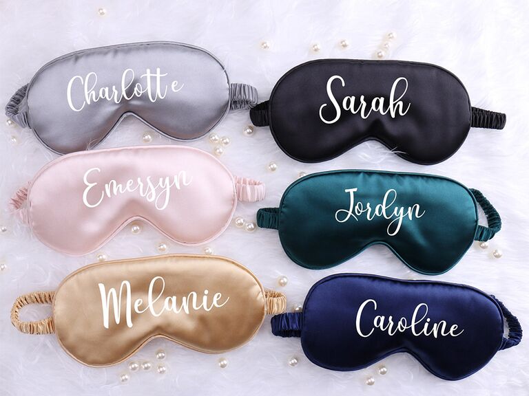 Sleeping masks in different colors with personalized names in white script