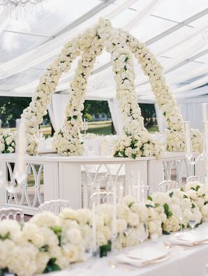Floral Arch of White Flowers Over All-White Bar at Tented Wedding Reception