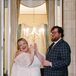Bride in Mini Dress and Puffed Sleeves and Groom in Blue Checkered Suit Clapping