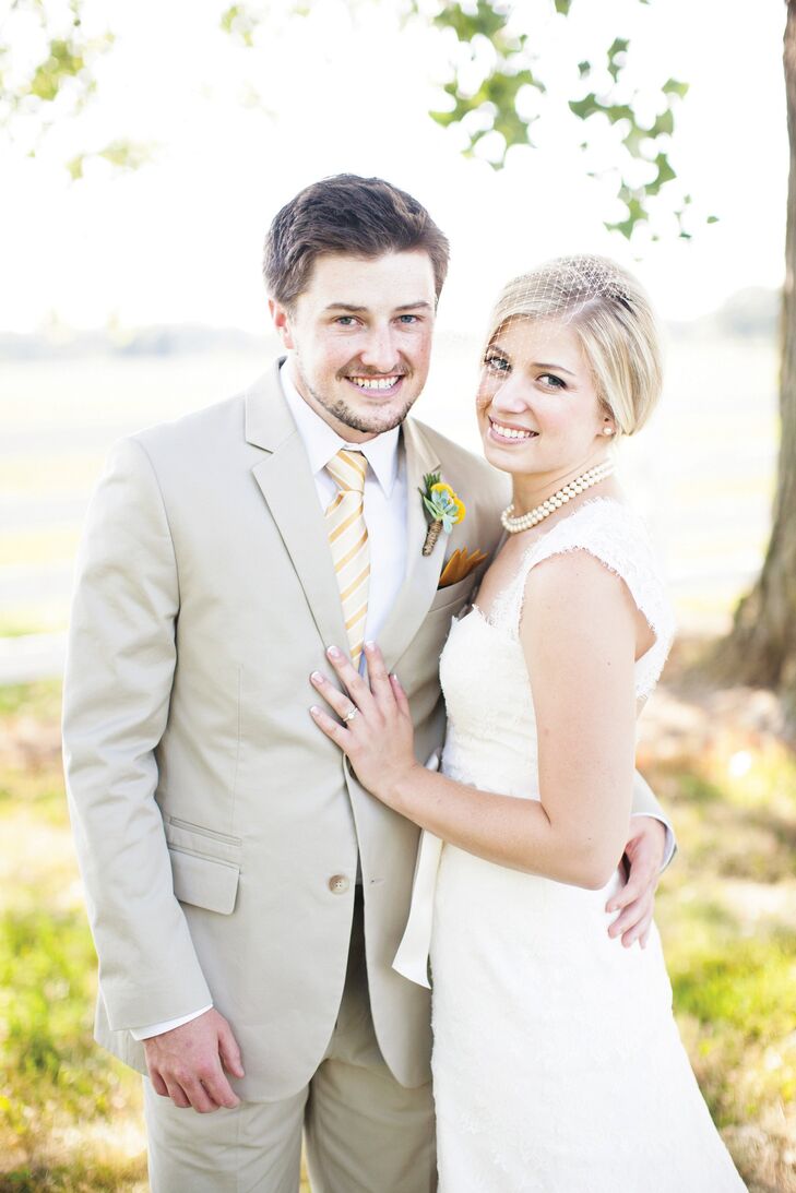 Krysten went with a classic ivory lace gown, while Lucas chose a khaki suit.