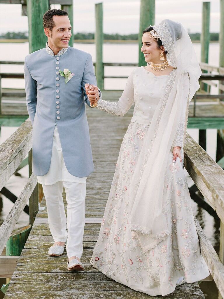 Couple holding hands and smiling