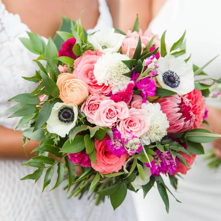 Anemone and protea bouquet in bright pinks and whites