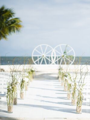 Casual Beach Aisle Lined with Vases with Branches
