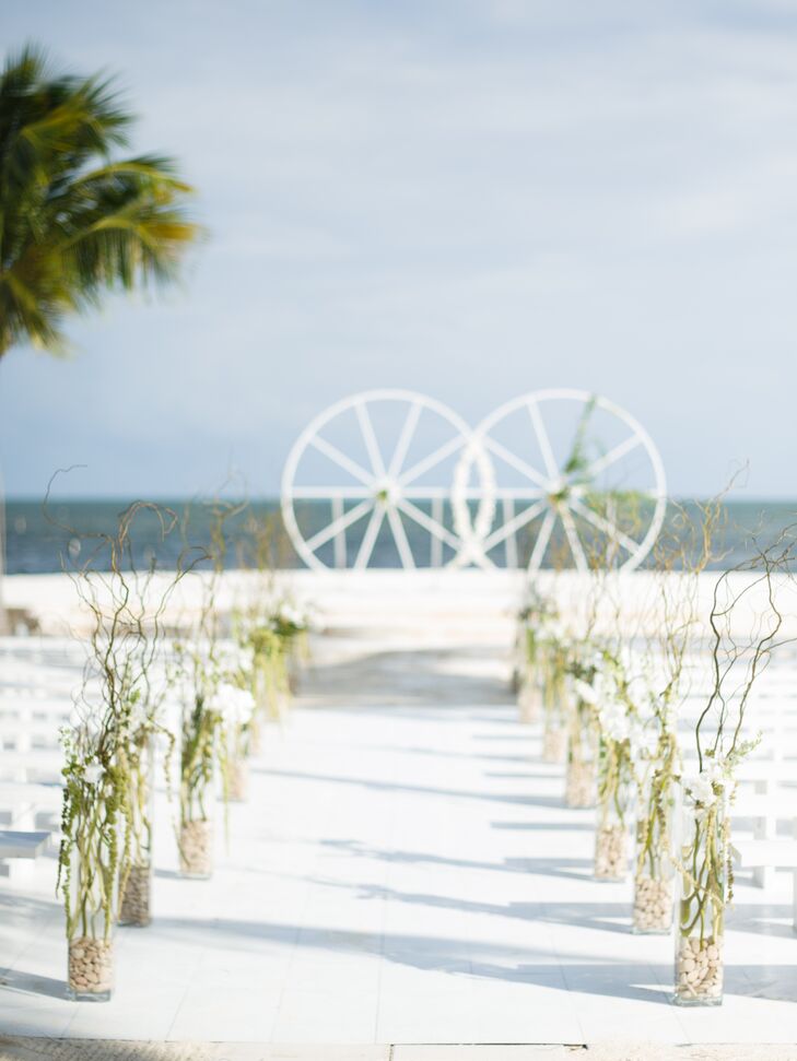 Casual Beach Aisle Lined with Vases with Branches