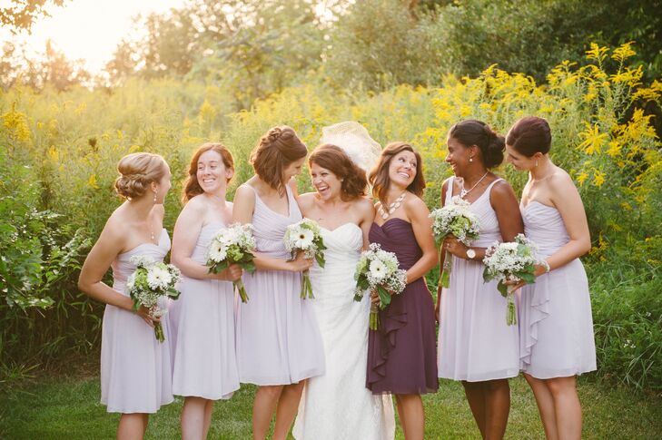 Katie let her bridesmaids choose from a variety of dress styles so that everyone felt comfortable at the ceremony. Katie's sister, her maid of honor, wore a plum-colored dress, which complemented the lavender.