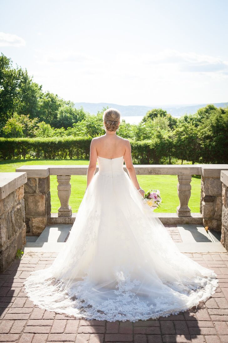 Lindsay wore a beautiful Pronovias A-line wedding gown with lace detailing on the train and throughout the skirt.