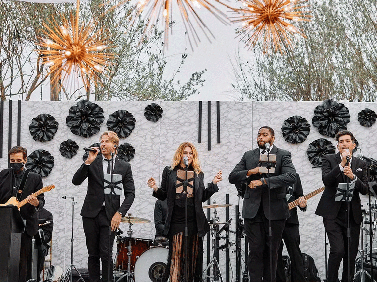 Live band performing top 100 love songs for wedding.