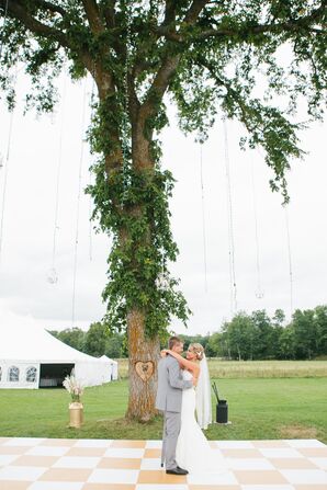 Bride and Groom Dance Under Wedding Elm Tree with Chandeliers and Garlands