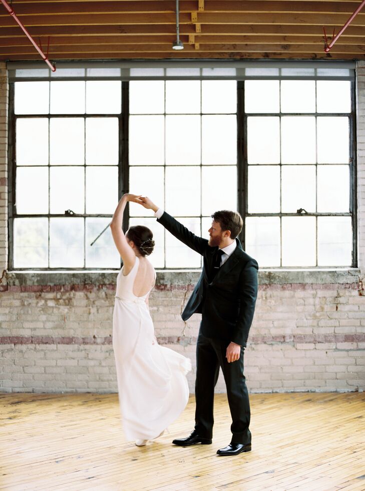 Bride and Groom Sharing Private Dance at Industrial Venue