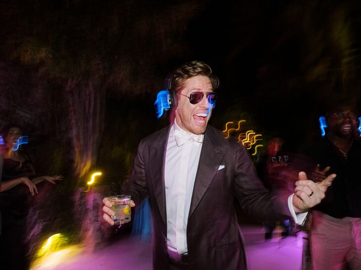 Groom in Sunglasses and Headphones Dancing at Silent Disco Reception