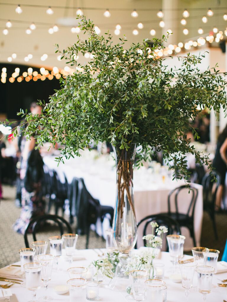 simple tall greenery centerpiece with boxwood branches