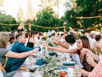 guests toasting wedding guest etiquette at reception