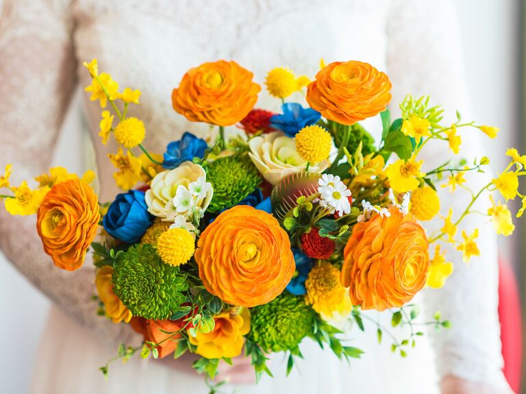 A vibrant orange, yellow, blue, and green bouquet.