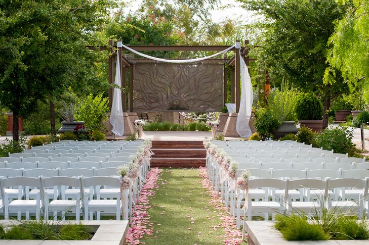 The ceremony arch was loosely draped with white chiffon, adding a touch of elegance.