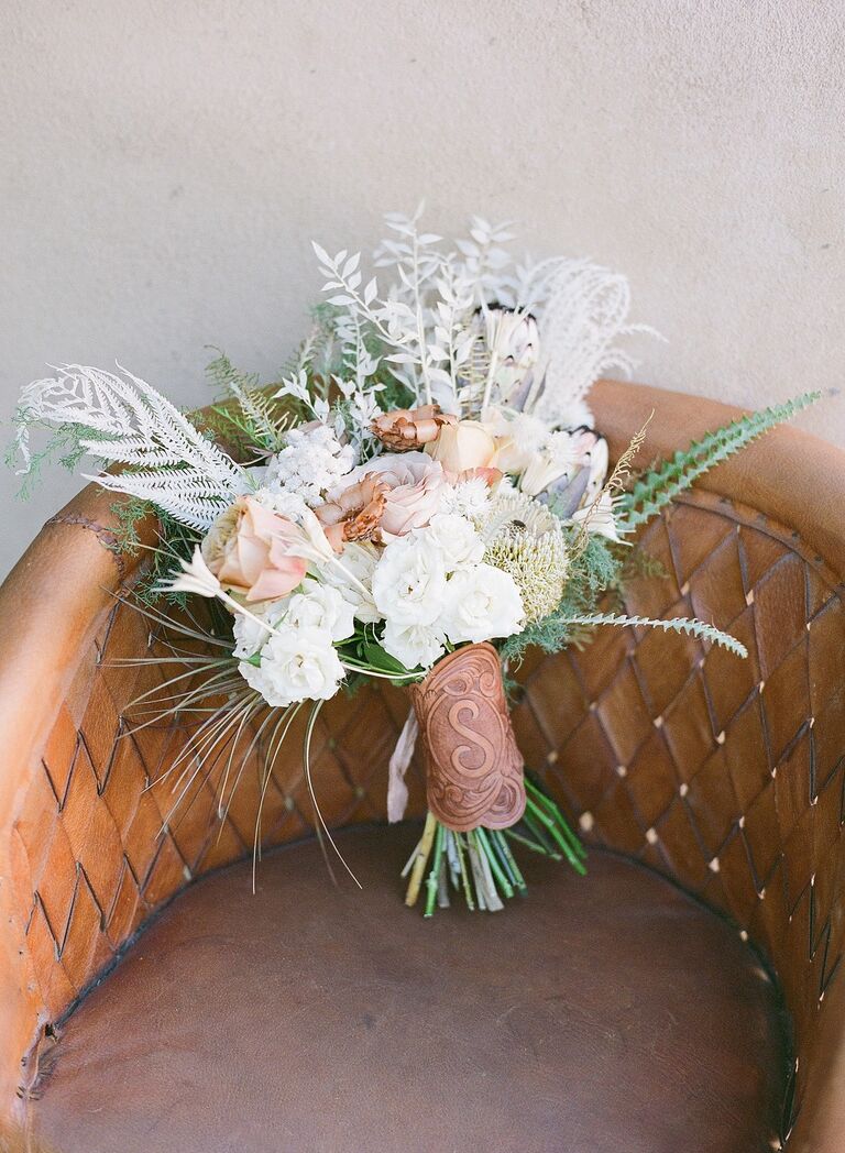 Bouquet with an embossed leather bridal bouquet holder