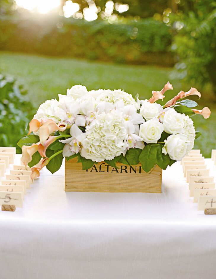 The escort cards were written by a local Hawaiian woman in dark brown ink and placed in slotted wine corks to keep in theme with the French vineyard style of the wedding.