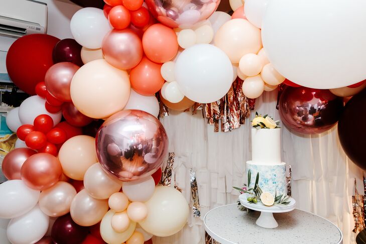 Cake Display with Balloon Garland at Wedding in Australia