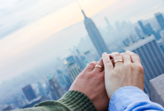 Married couple holding hands in NYC