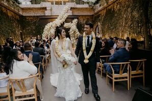 Bride With Lei and White Bouquet Walking in Recessional With Groom in Lei