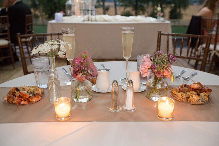 Designed by Candlelight Floral Designs in Middletown, MD, the floral arrangements consisted of roses, freesias, hydrangeas, eucalyptus and dusty miller. "We didn't want anything to look too staged, so we scattered votive candles and different size vases," says Brittany.