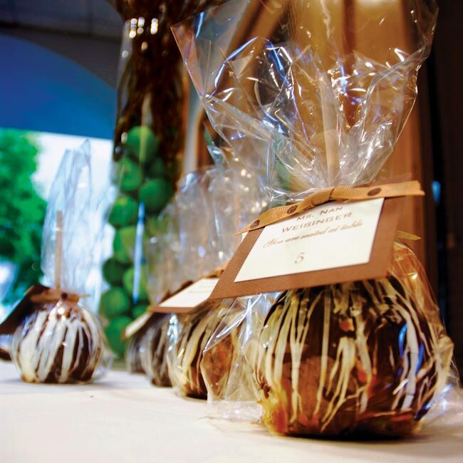 “To incorporate the colors of the day into the favors, and to share one of our favorite treats with our guests, we chose caramel-dipped, chocolate-covered apples as favors for our guests,” Melissa explains. Green Granny Smith apples were dipped in caramel and then drizzled with milk and white chocolate. The monogrammed tags on the apples also told guests where to sit, letting the favors do double duty as escort cards.
