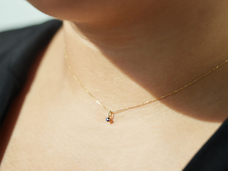 Dainty sapphire raindrop stone on gold chain