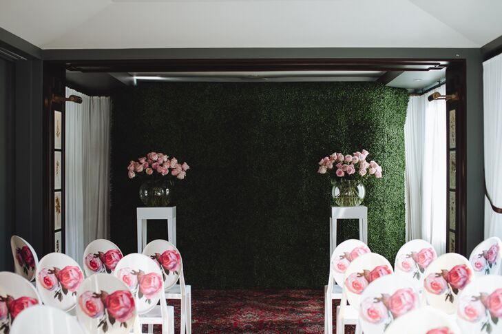 The festivities kicked off with an indoor ceremony on the rooftop of the NoMad Hotel in New York, New York. A grassy backdrop, bouquets of fresh blush roses and modern white chairs decorated with pink rose decals channeled an English garden at the peak of summer, bringing Whitney and Ryan’s whimsical vision to life.
