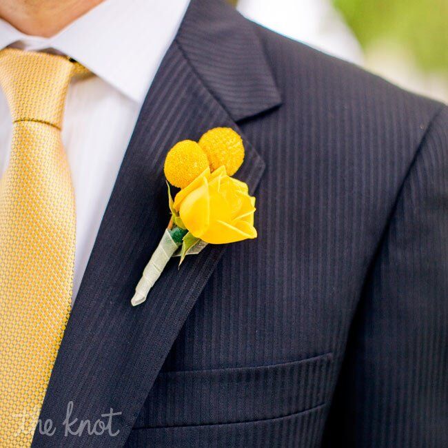 Phil wore a yellow rose and billy ball boutonniere to match his gold tie.