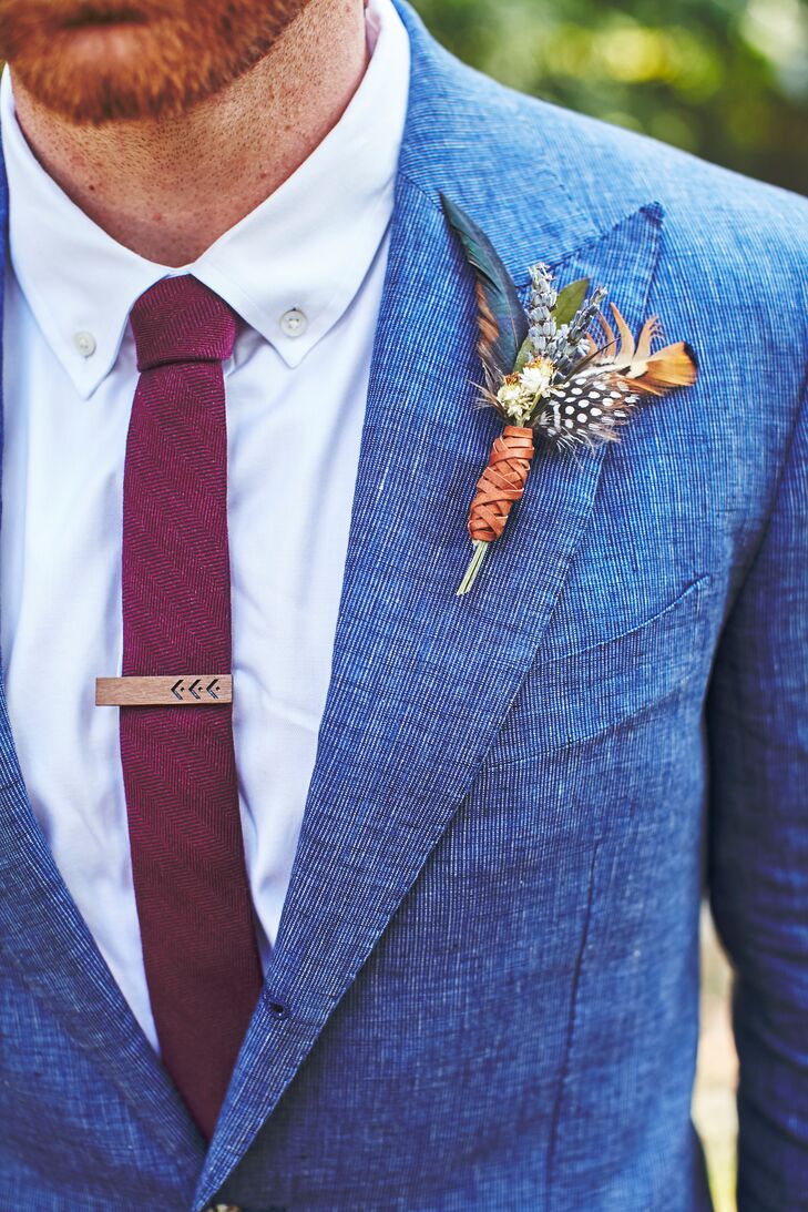 Angela made Cameron’s boutonniere with lavender, globe thistle and feathers, then wrapped it in brown leather.