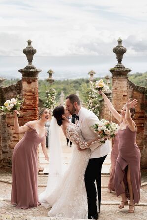 Bride and Groom Kiss During Castle Wedding Ceremony
