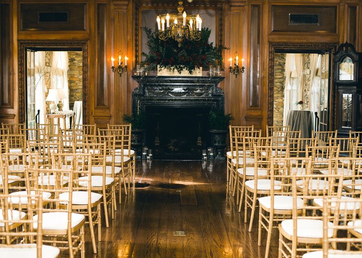 Wood paneled walls and an elegant fireplace decorated with a lush floral arrangement lent the ceremony an air of old-world charm.