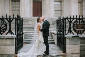 Elegant Couple with Formfitting Dress, Updo and Black Suit