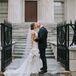 Elegant Couple with Formfitting Dress, Updo and Black Suit