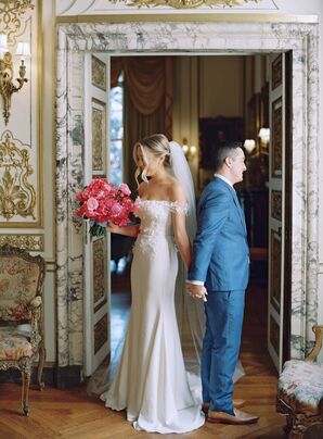 Bride and Groom Hold Hands Without Looking at First Look in Historic Location