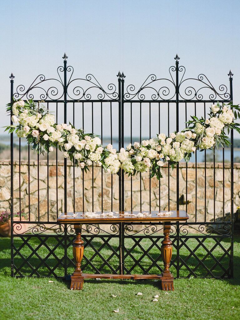 wrought-iron gates ceremony backdrop for outdoor wedding