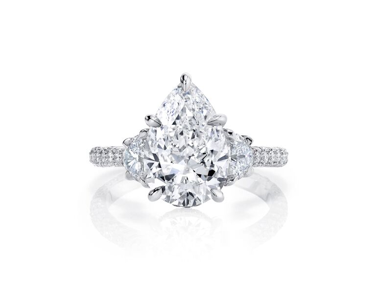 three stone engagement ring with pear shaped diamond